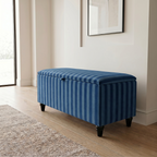 Modern hallway with a Blue striped storage ottoman with black legs on a wooden floor