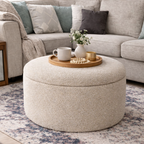 Oyster Boucle round storage pouffe in a modern living room setting 