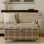 Beige sofa with plaid ottoman in a living room setting