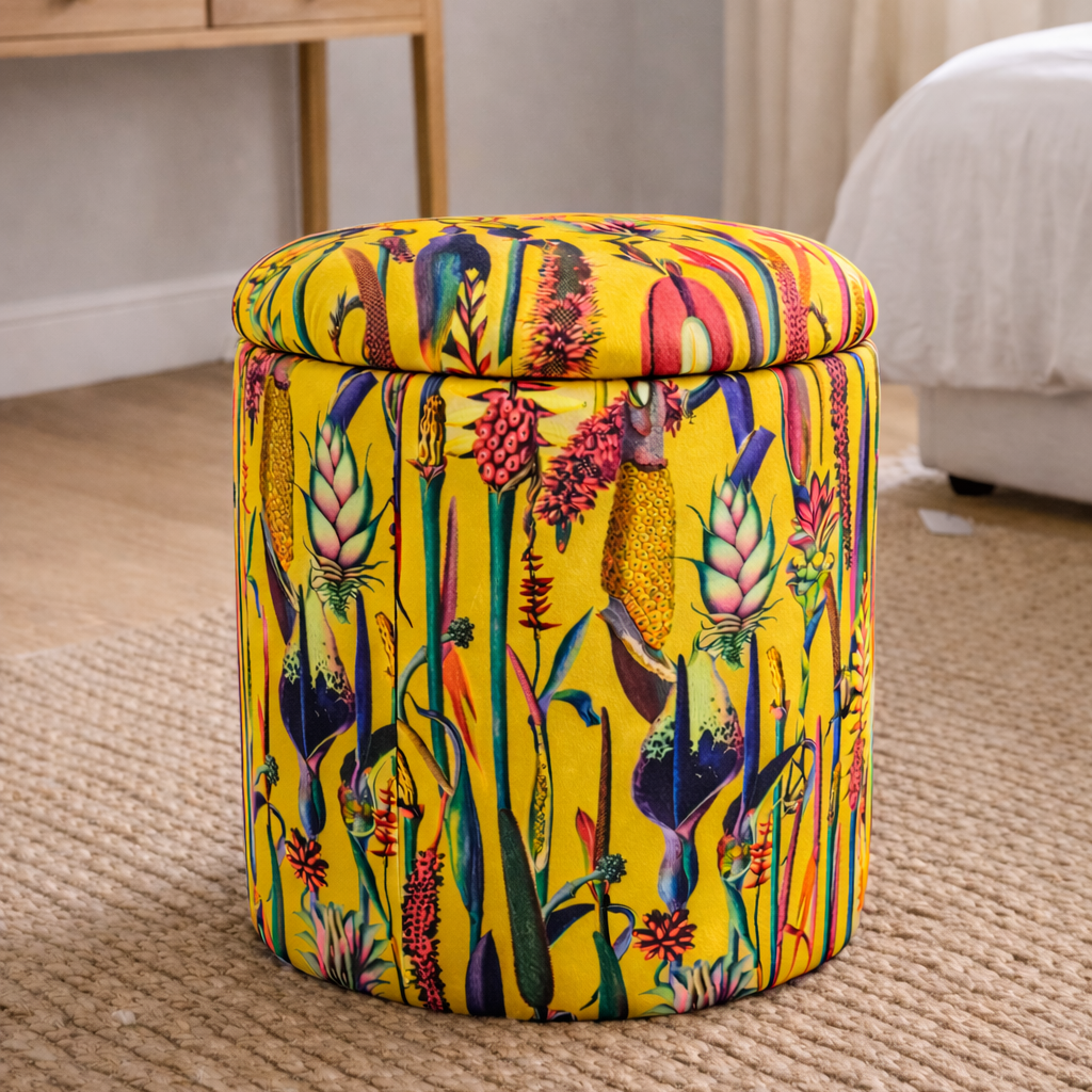 Colorful patterned ottoman in a room with a desk and decor.