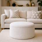 Ivory storage ottoman on the floor with a sophisticated living room setting