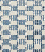 A close-up of a iLiv Flint fabric pattern featuring a blue and off-white checkered design with small geometric diamond motifs.