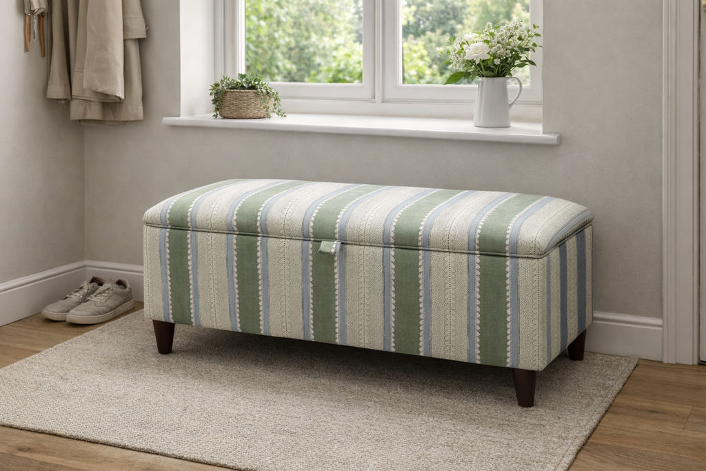 Green Wavy Striped ottoman in a room with a window and plants