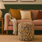 Living room with a pink sofa, Linwood chisel beach patterned ottoman, and abstract art on the wall.
