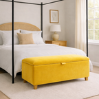 Bedroom with a four-poster bed and yellow ottoman