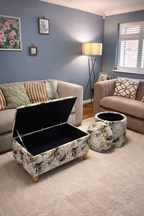 Living room with floral-patterned storage ottomans