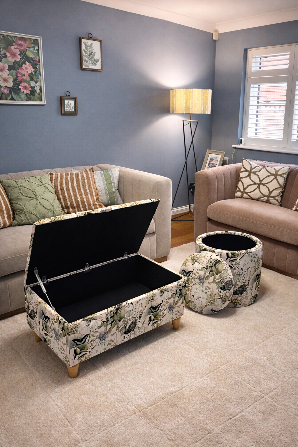 Living room with floral-patterned storage ottomans