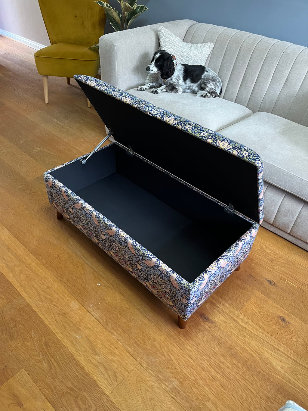 Living room with an open William morris strawberry thief ottoman footstool 