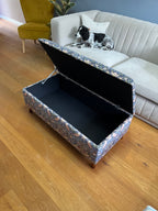 Living room with an open William morris strawberry thief ottoman footstool 