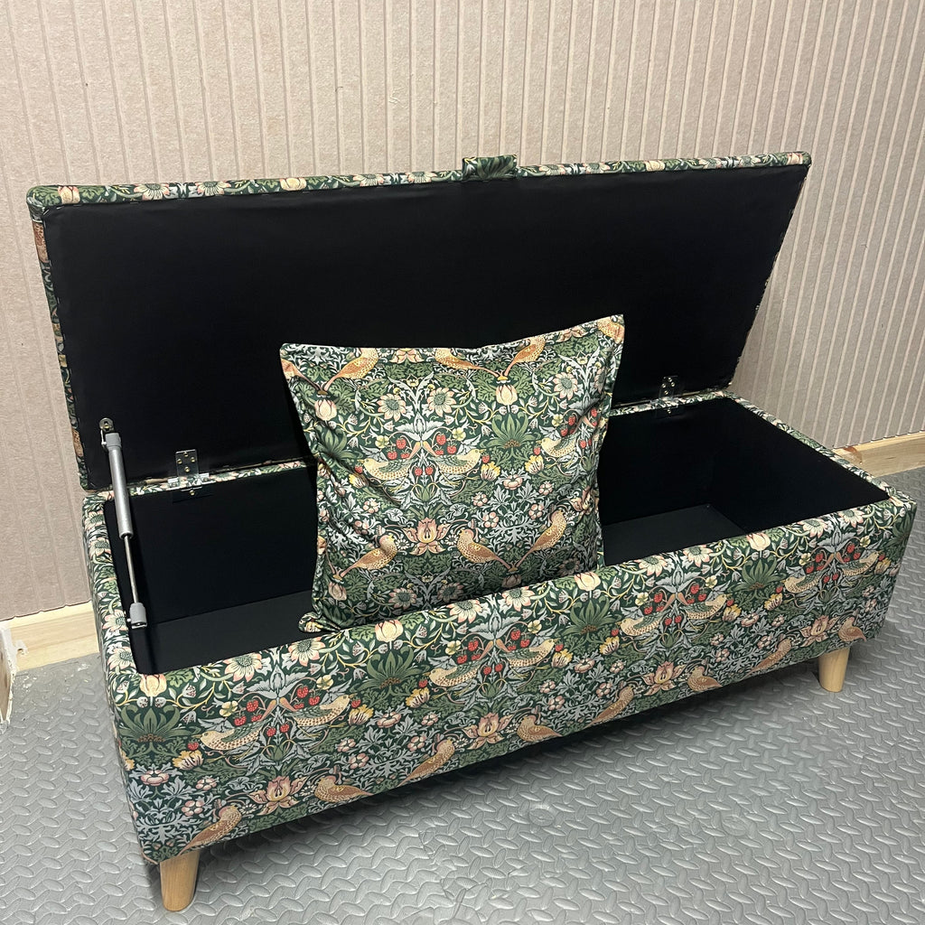 Decorative bench with floral pattern on a textured wall background