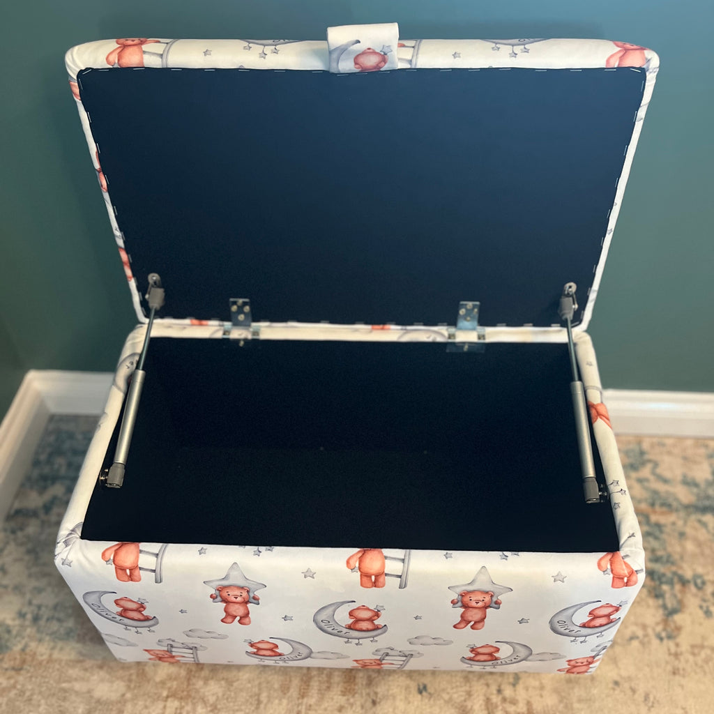 white custom name toy box with teddy bears on and moons on. The box is open with black fabric interior