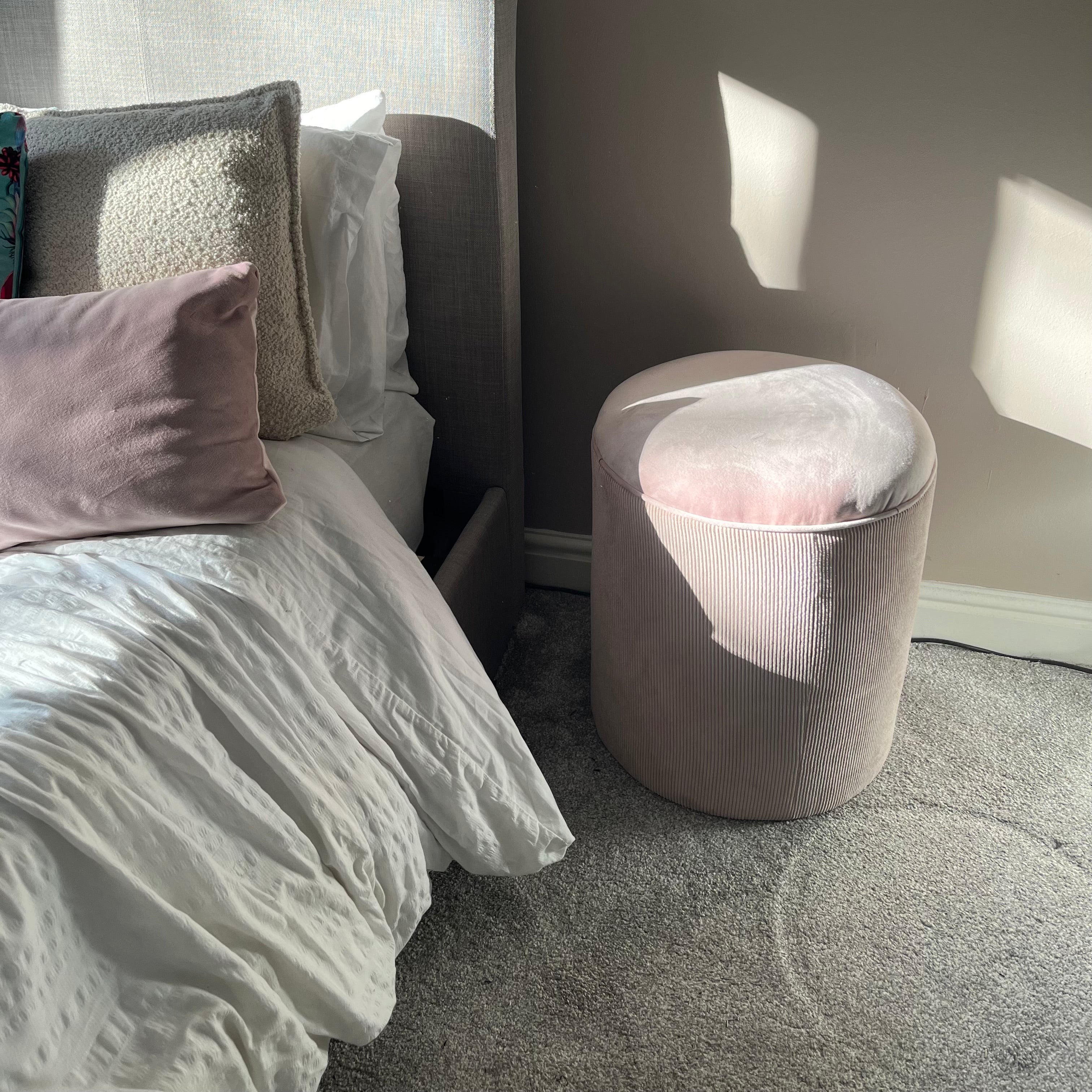 Light pink striped bedroom pouffe chair