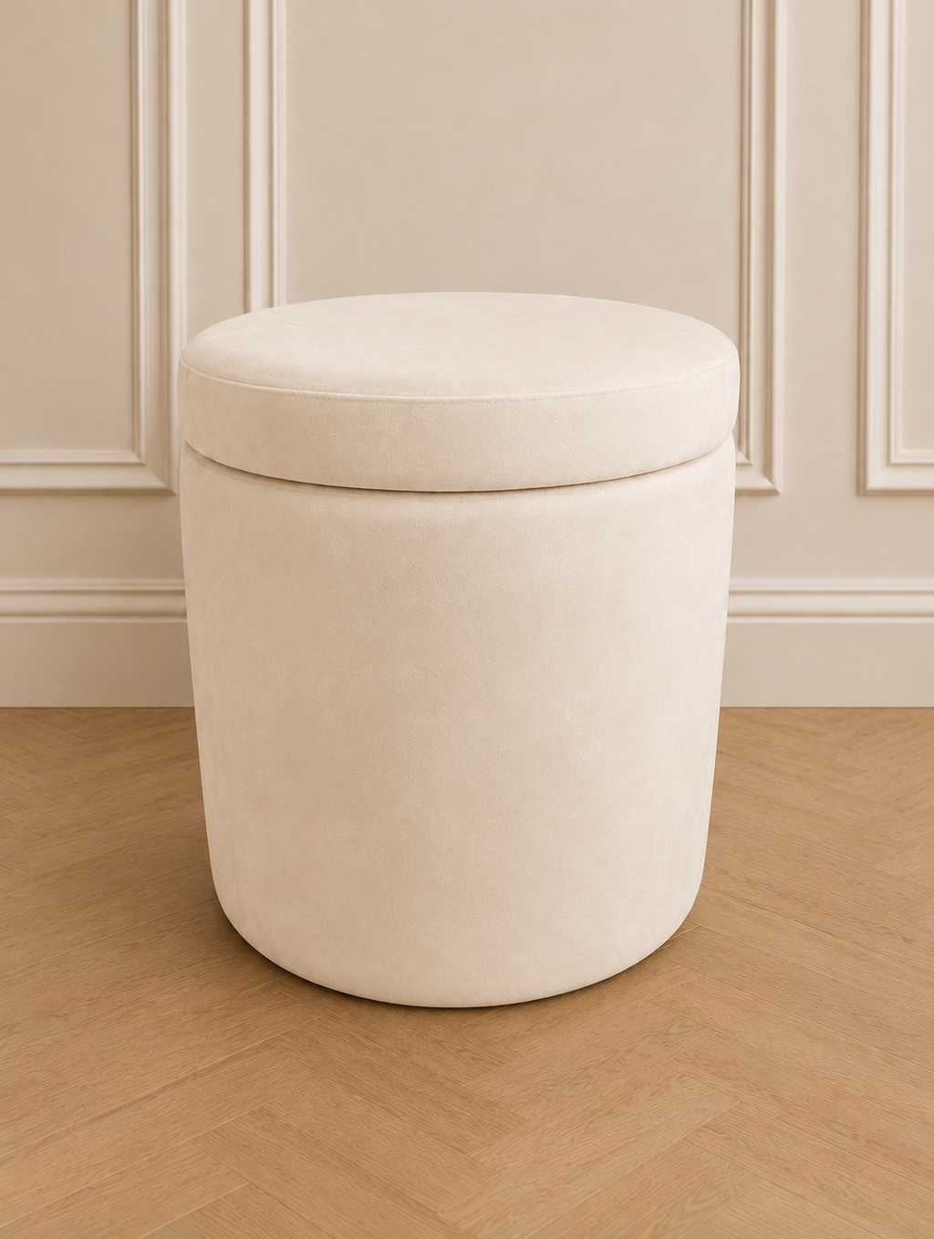 Cream snow storage stool sat on a herringbone floor with beige panelled walls behind.