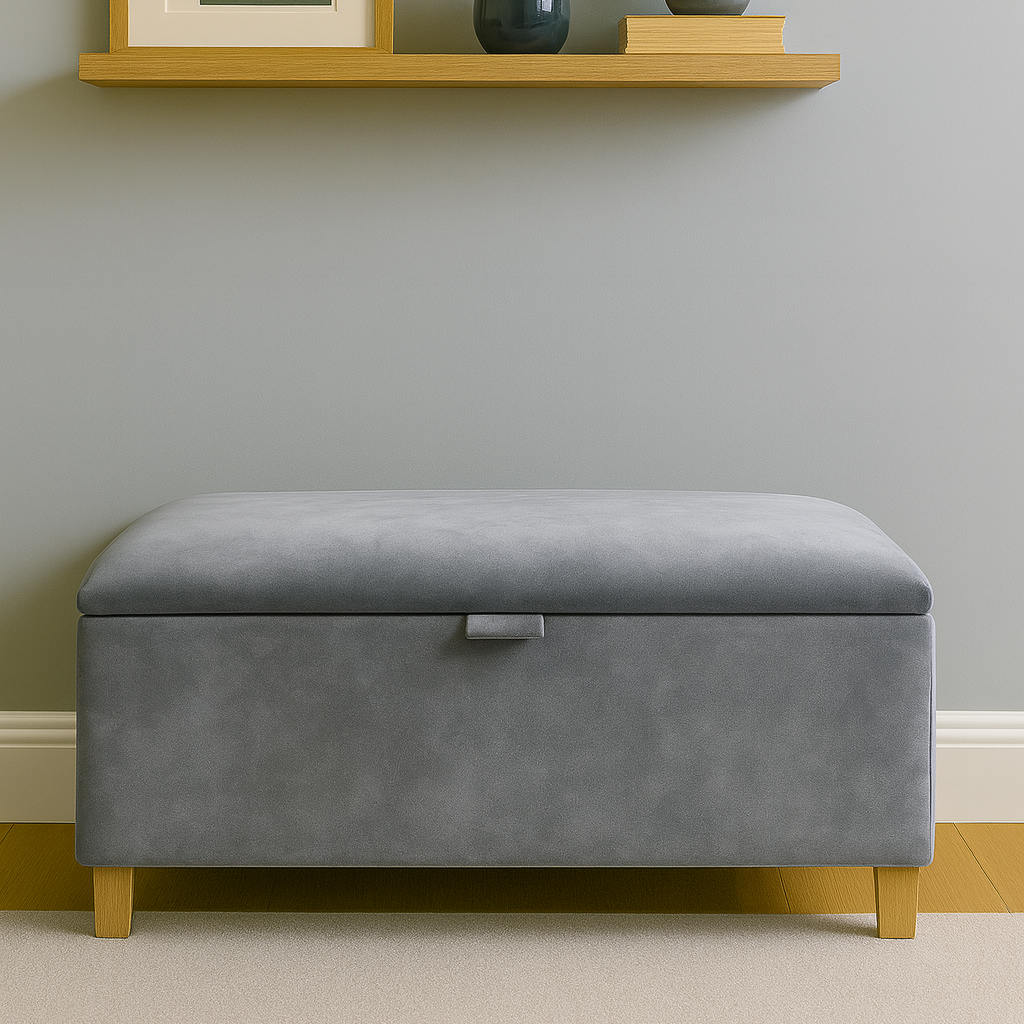 Gray storage ottoman in a room with a shelf and decorative items.