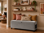 Slate Grey storage bench with a side pet opening and decorative pillows in a living room setting.