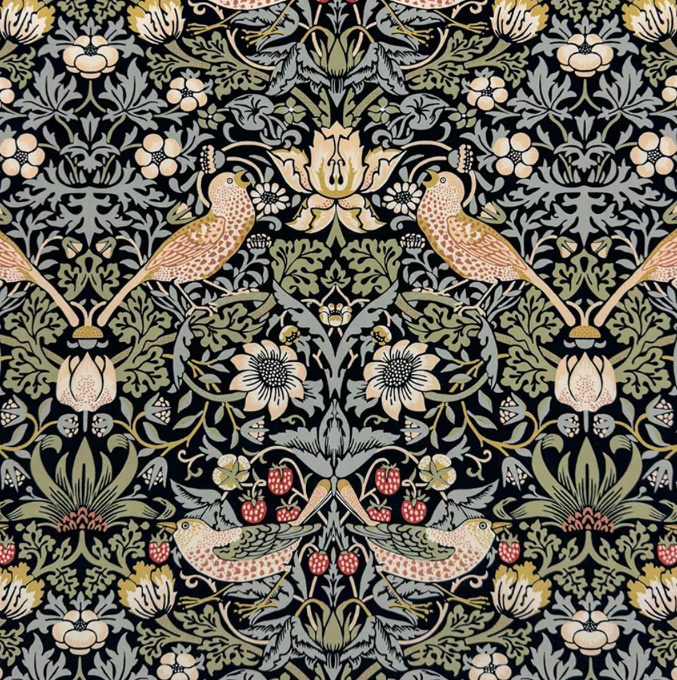 A rectangular storage ottoman upholstered in a beige William Morris floral velvet fabric with wooden bun feet.