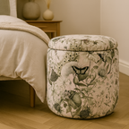 Decorative ottoman with floral pattern in a bedroom setting