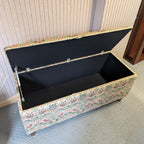 Floral-patterned William morris storage bench with open lid on a neutral background
