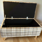 beige storage ottoman trunk with cream checks open with gas strut hinges
