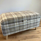 beige tartan check storage ottoman box with angled wooden feet