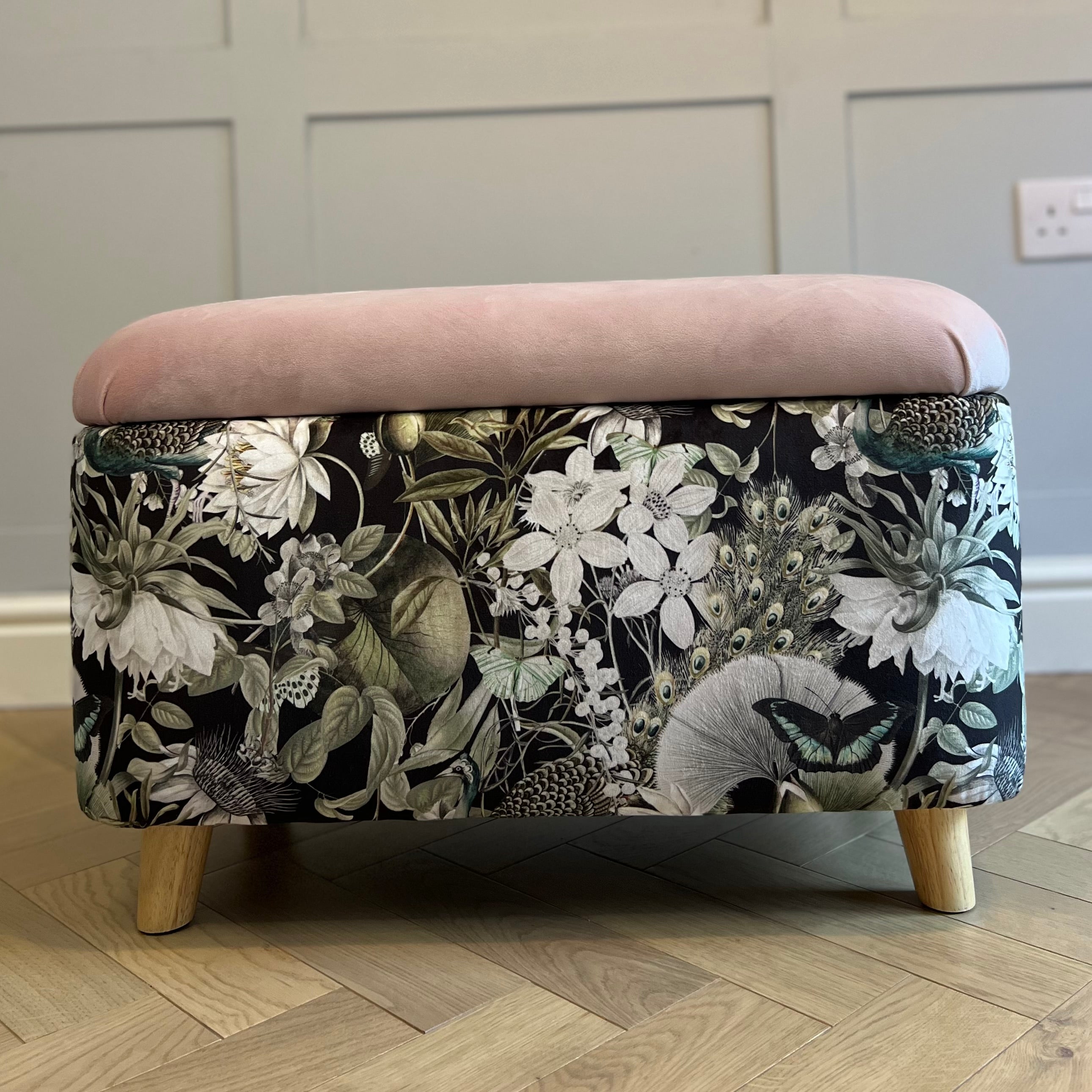 black utopia storage ottoman box with a pink lid and angled wooden feet