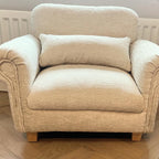beige mini dog sofa with trapeze feet and a small cushion. Upholstered in chenille fabric