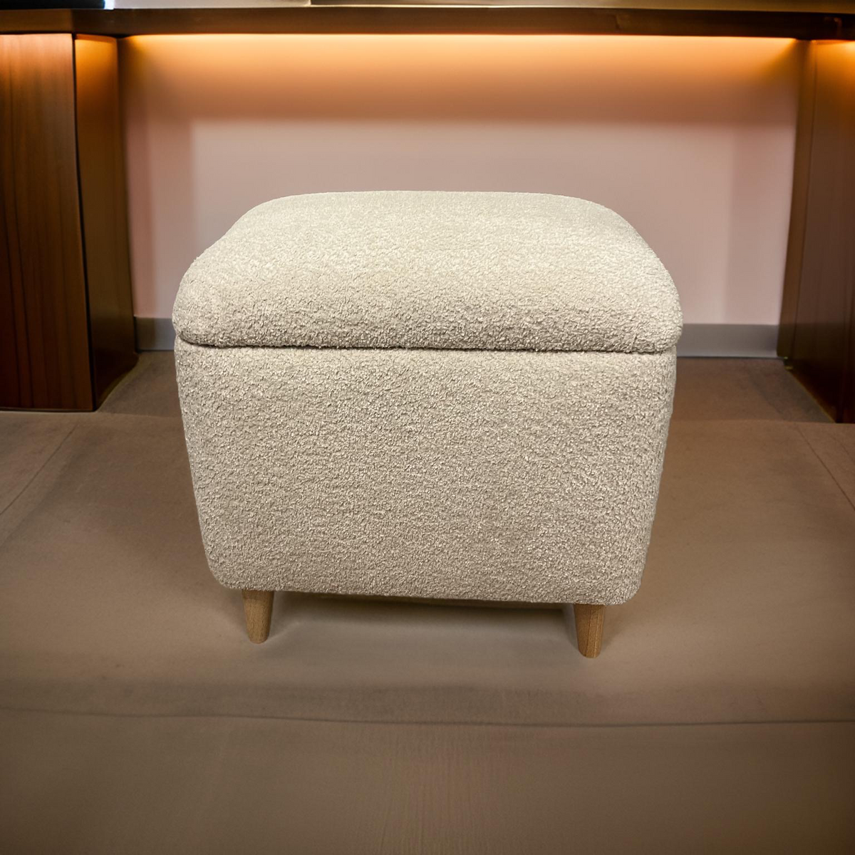 cream teddy soft dressing table stool with angled wooden legs and a storage lid