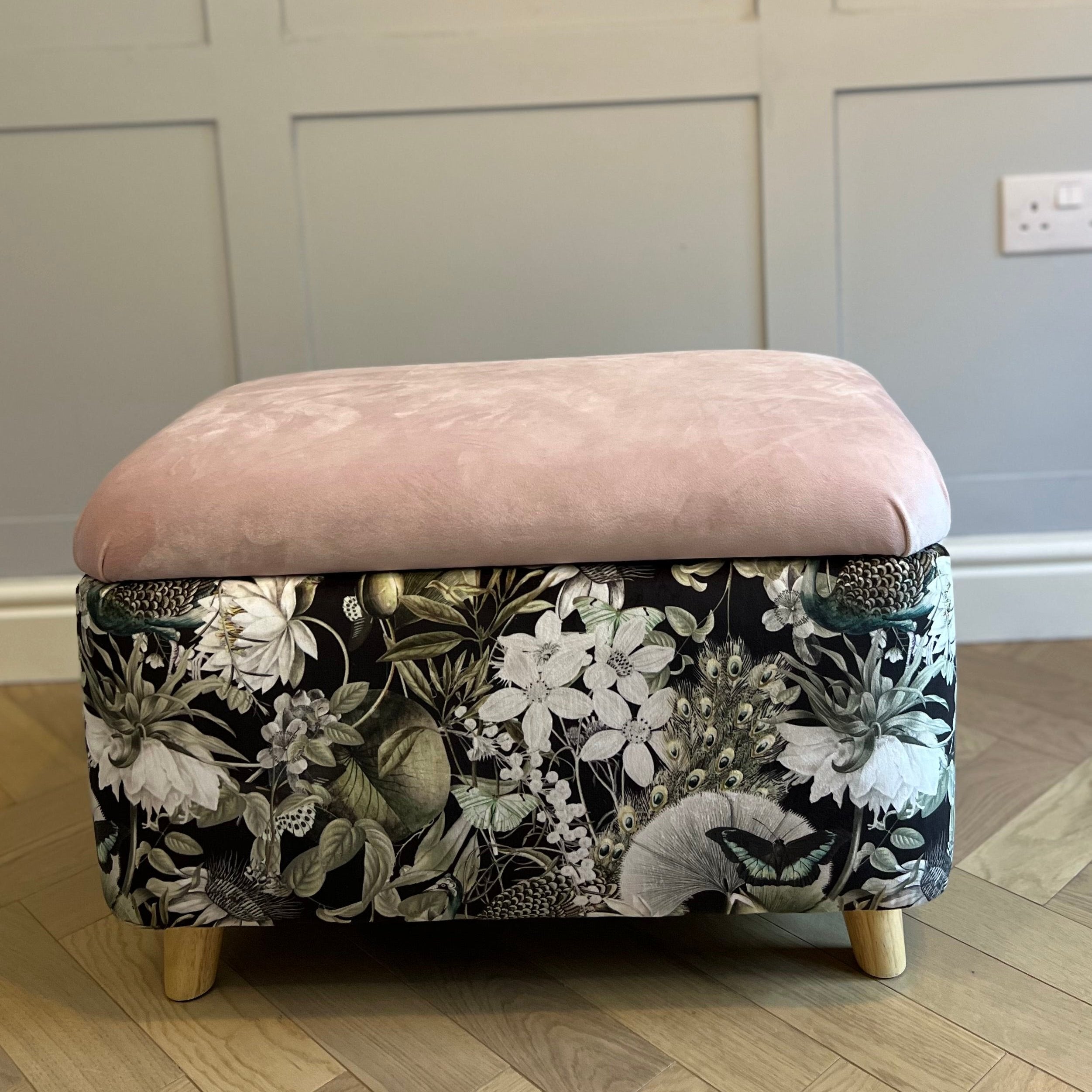 black utopia floral storage footstool with a pink lid and wooden feet