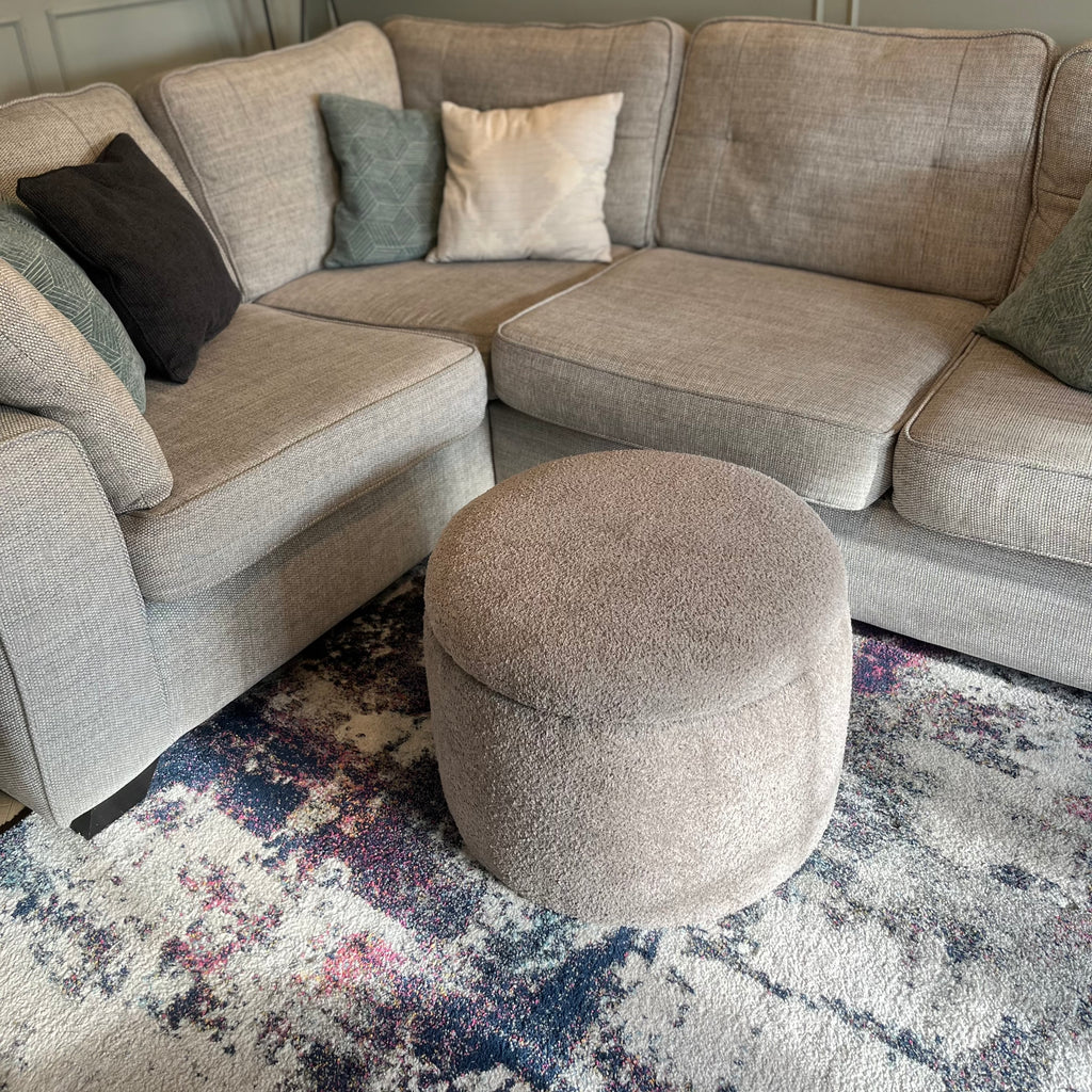 griege Teddy boucle storage ottoman coffee table with removable lid in front of cream sofas