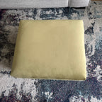 small olive green foot rest and stool with piping trim
