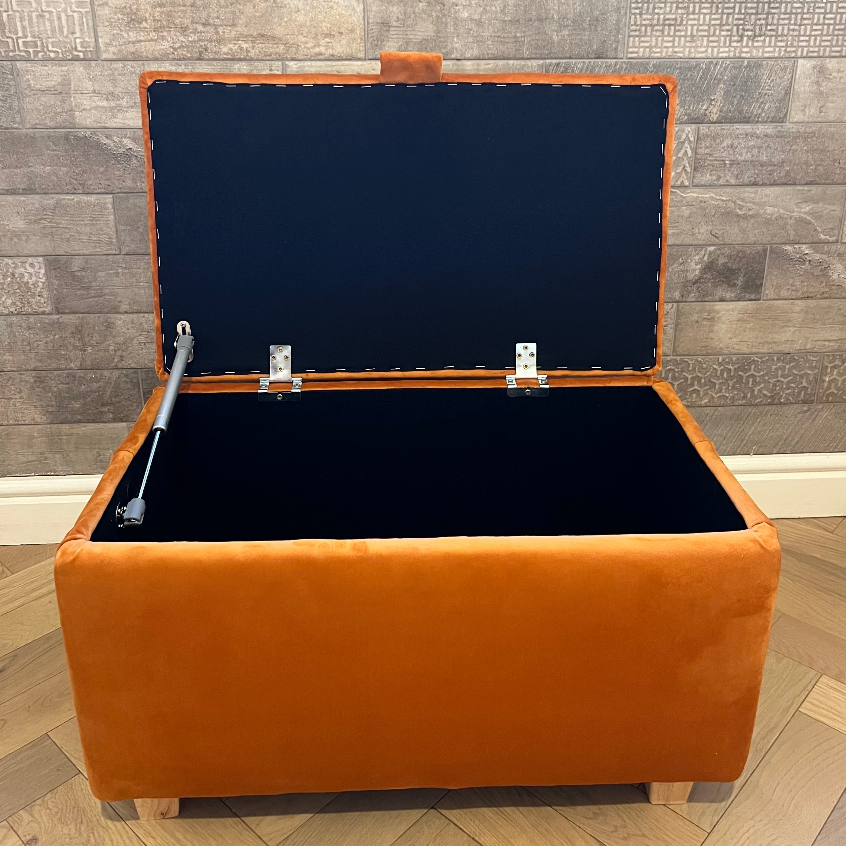storage ottoman open in burnt orange velvet with gas struts and wooden feet