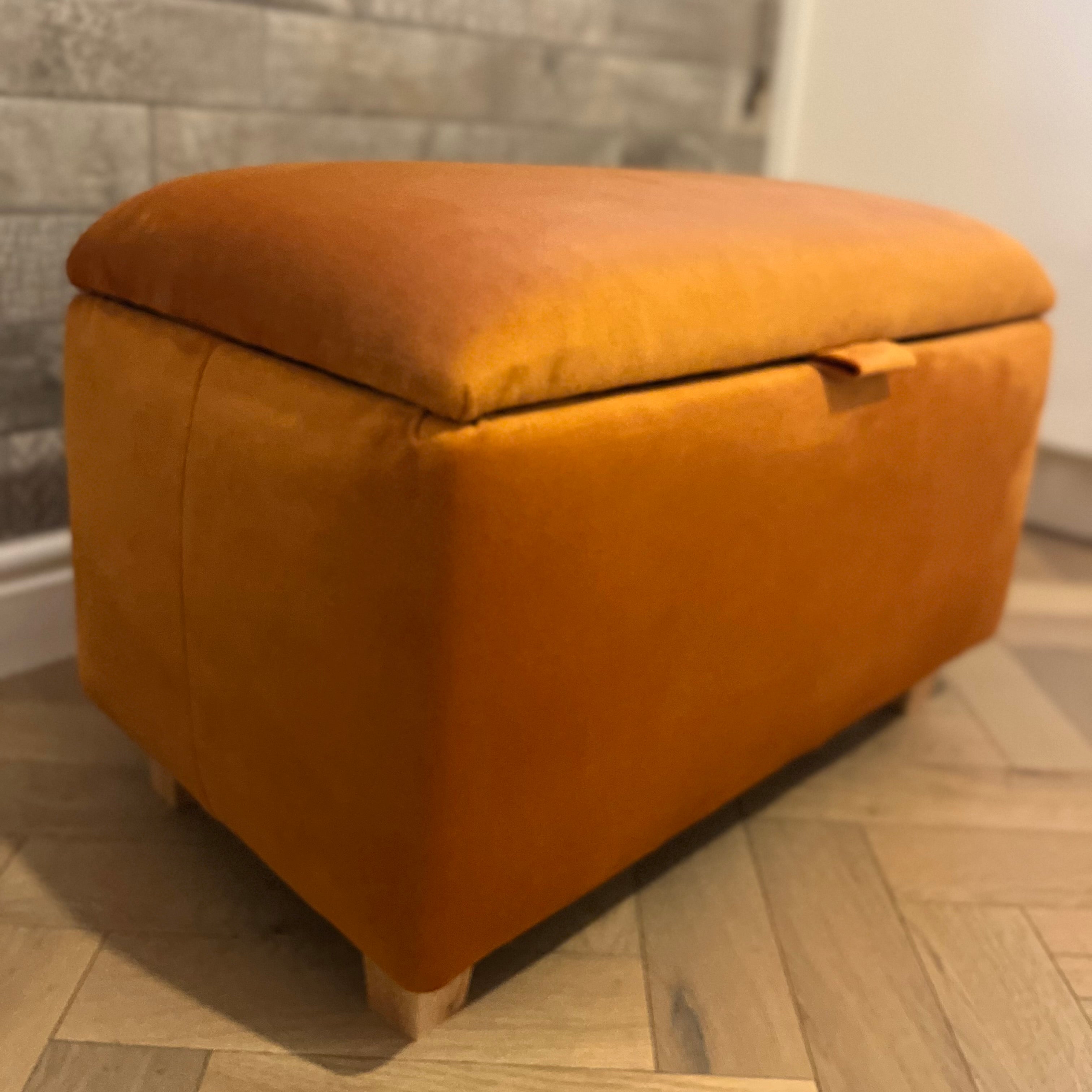 burnt orange bright ottoman storage chest with wooden legs
