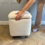 square vanity chair in boucle fabric showing a removable lid for interior storage